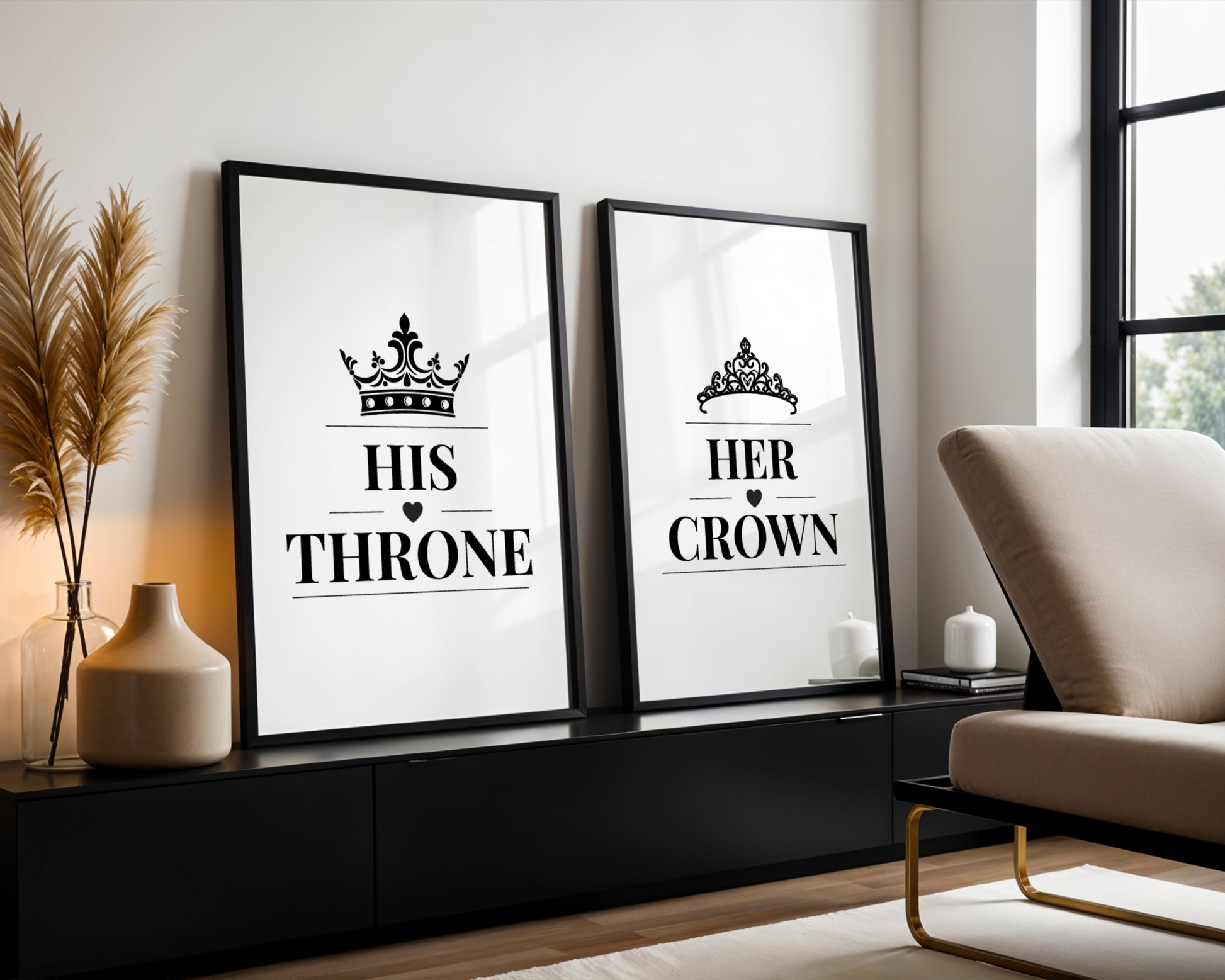 Two framed black-and-white typographic wall art prints leaning against a white wall in a modern living room. The left print reads “HIS THRONE” with a crown graphic, and the right print reads “HER CROWN” with a tiara graphic.