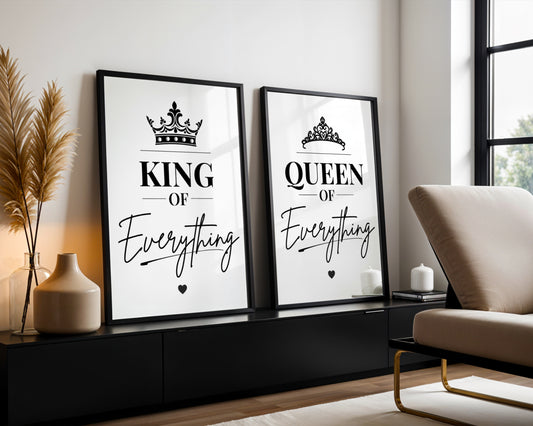 Two framed black-and-white decorative wall prints leaning against a wall in a modern room. The left print reads "KING OF Everything" with a crown graphic, and the right print reads "QUEEN OF Everything" with a tiara graphic.