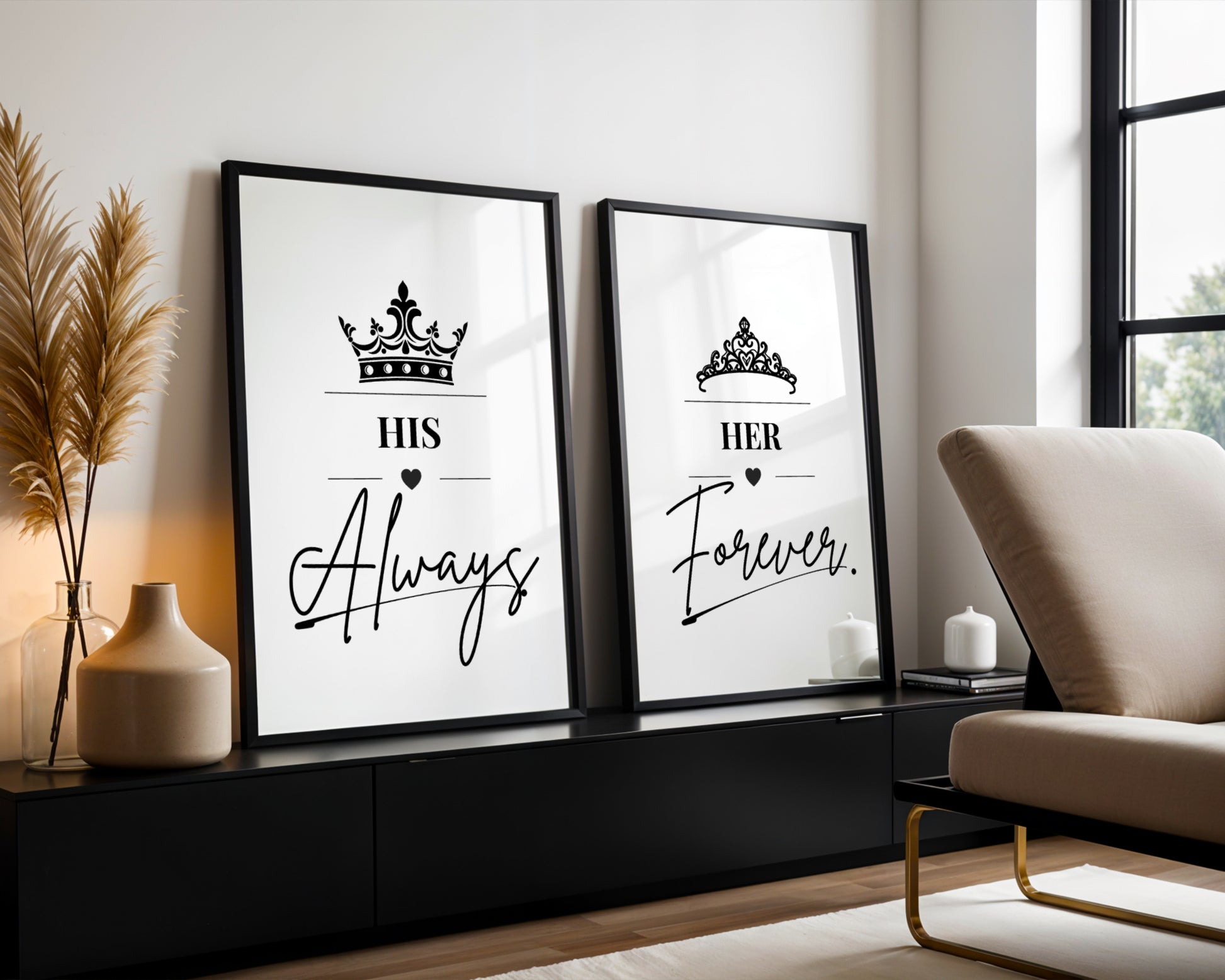 Two framed black-and-white typographic wall art prints leaning against a white wall in a modern living room. The left print reads “HIS Always” with a crown above, and the right print reads “HER Forever.