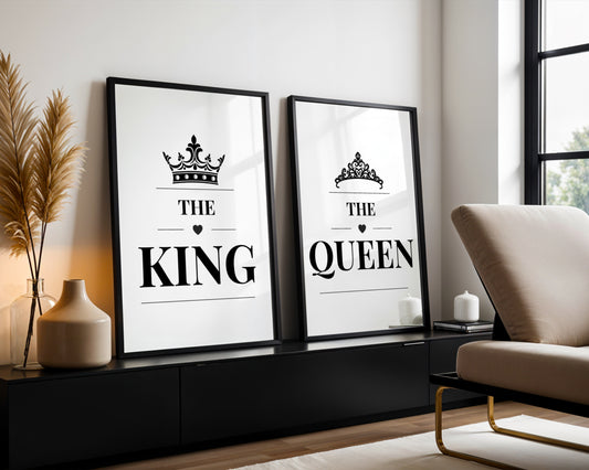 Two framed black-and-white decorative wall prints leaning against a wall in a modern living room. The left print reads “HER KING” with a crown above, and the right print reads “HIS QUEEN” with a crown above.