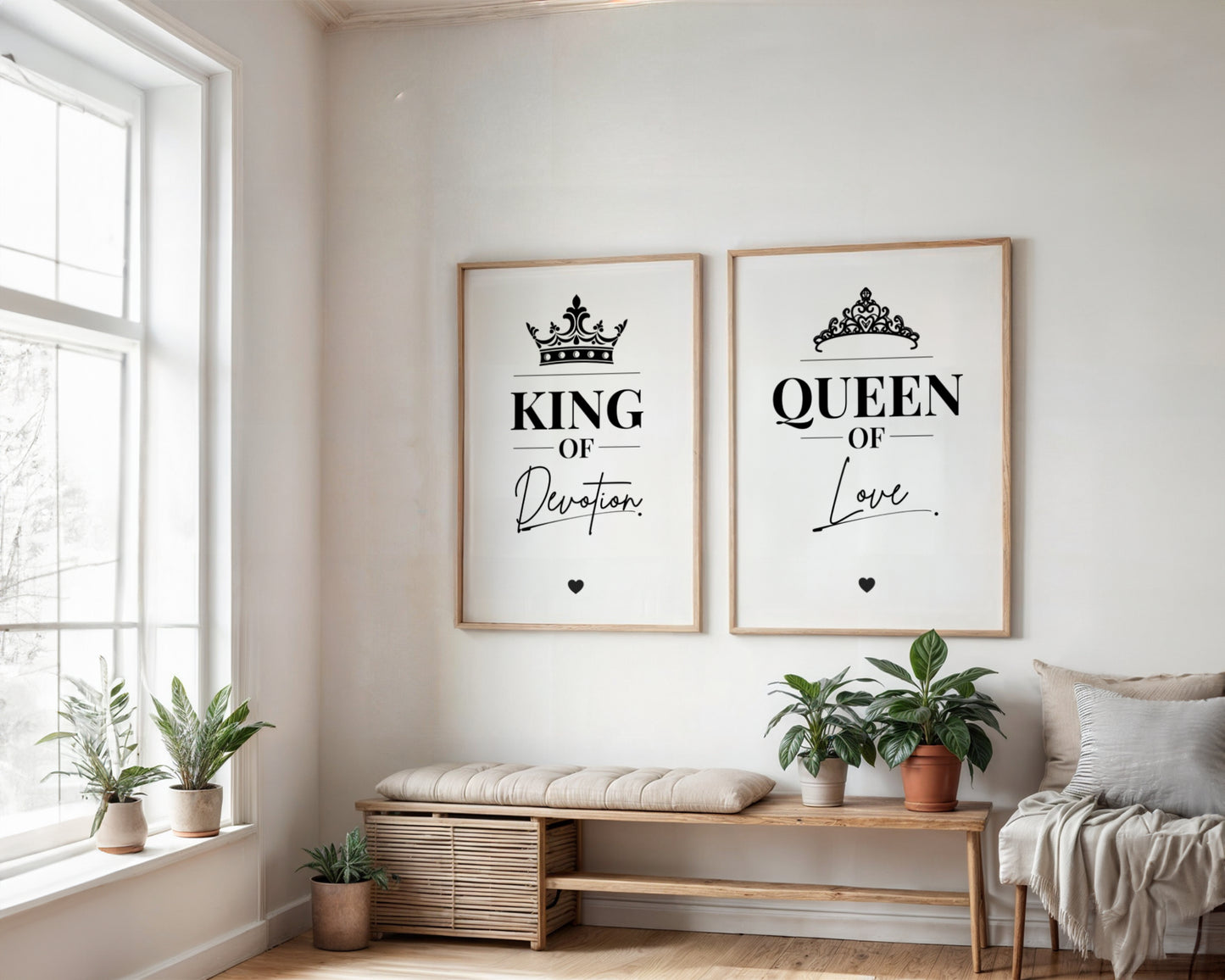 Two framed wall art prints hang above a wooden bench in a bright, modern room. The left print reads 'KING OF Devotion' with a crown above, and the right print reads 'QUEEN of Love' with a tiara above.