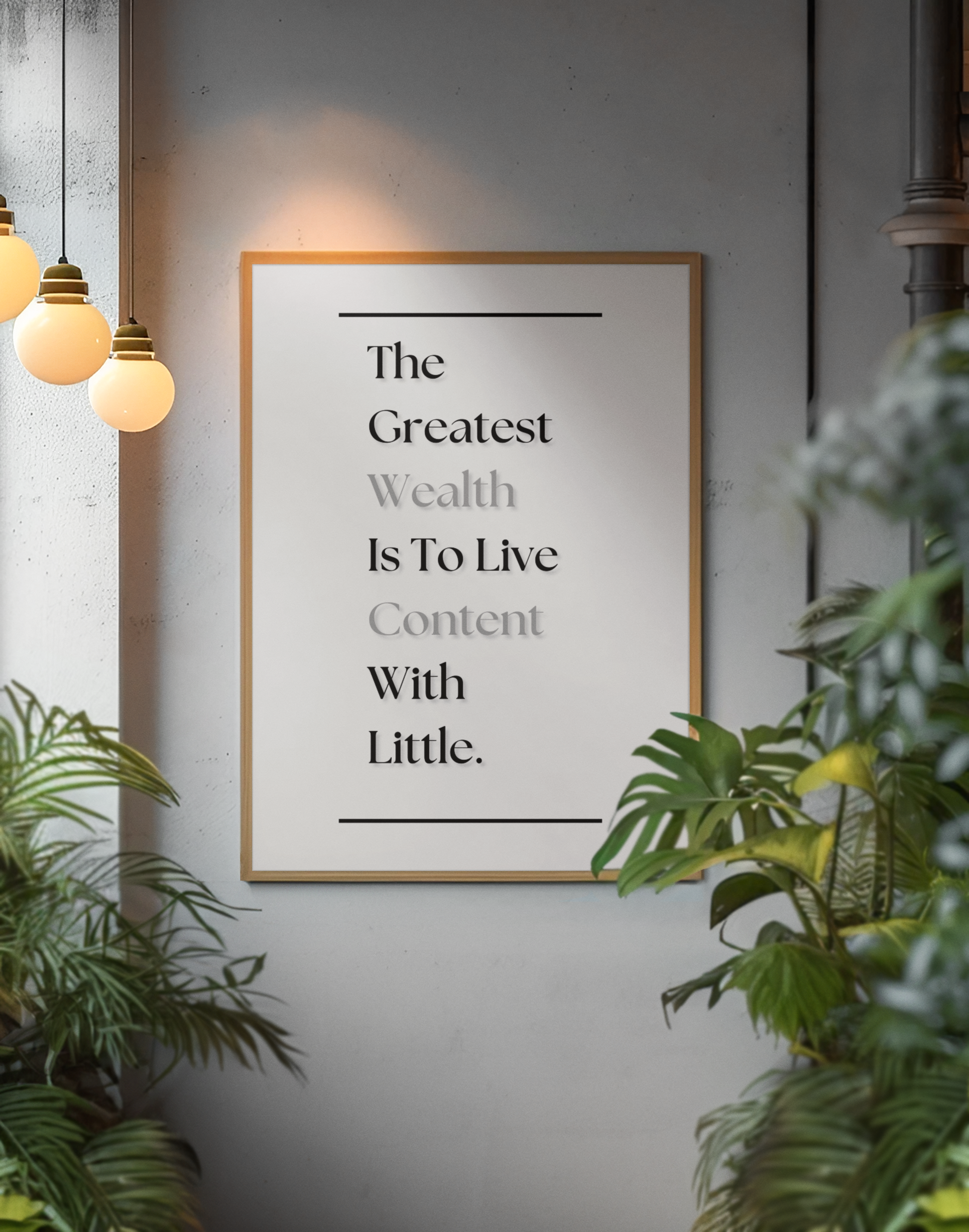 A framed motivational wall art print with the quote 'The Greatest Wealth Is To Live Content With Little', displayed on a gray wall, surrounded by green plants and warm hanging pendant lights.