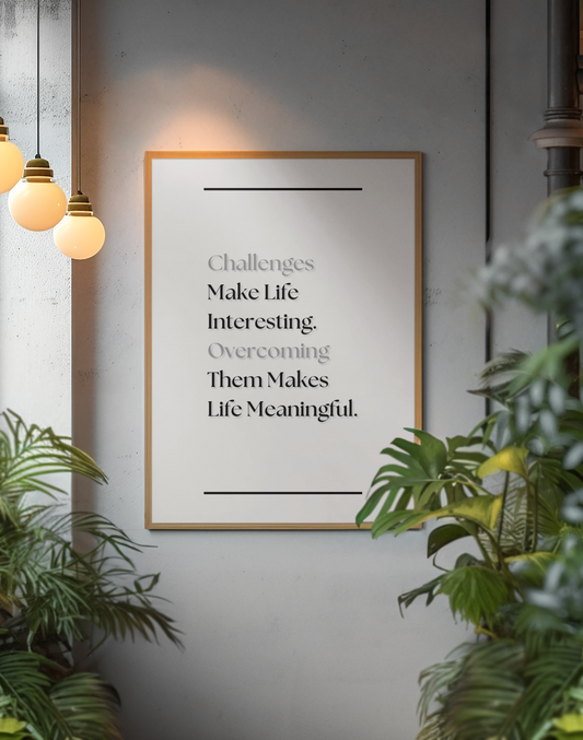 A framed motivational wall art print with the quote 'Challenges Make Life Interesting. Overcoming Them Makes Life Meaningful'.