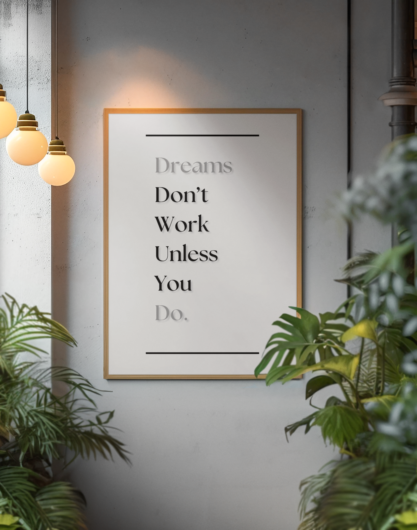 A framed motivational poster with the text 'Dreams Don't Work Unless You Do.' hanging on a gray wall, surrounded by green plants and warm hanging pendant lights.