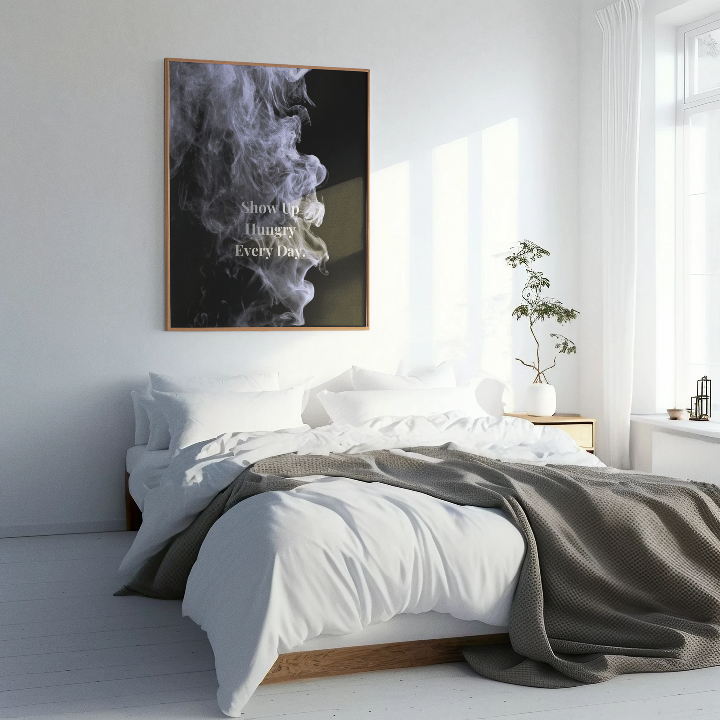 Modern bedroom with a bed, wall art, and plant