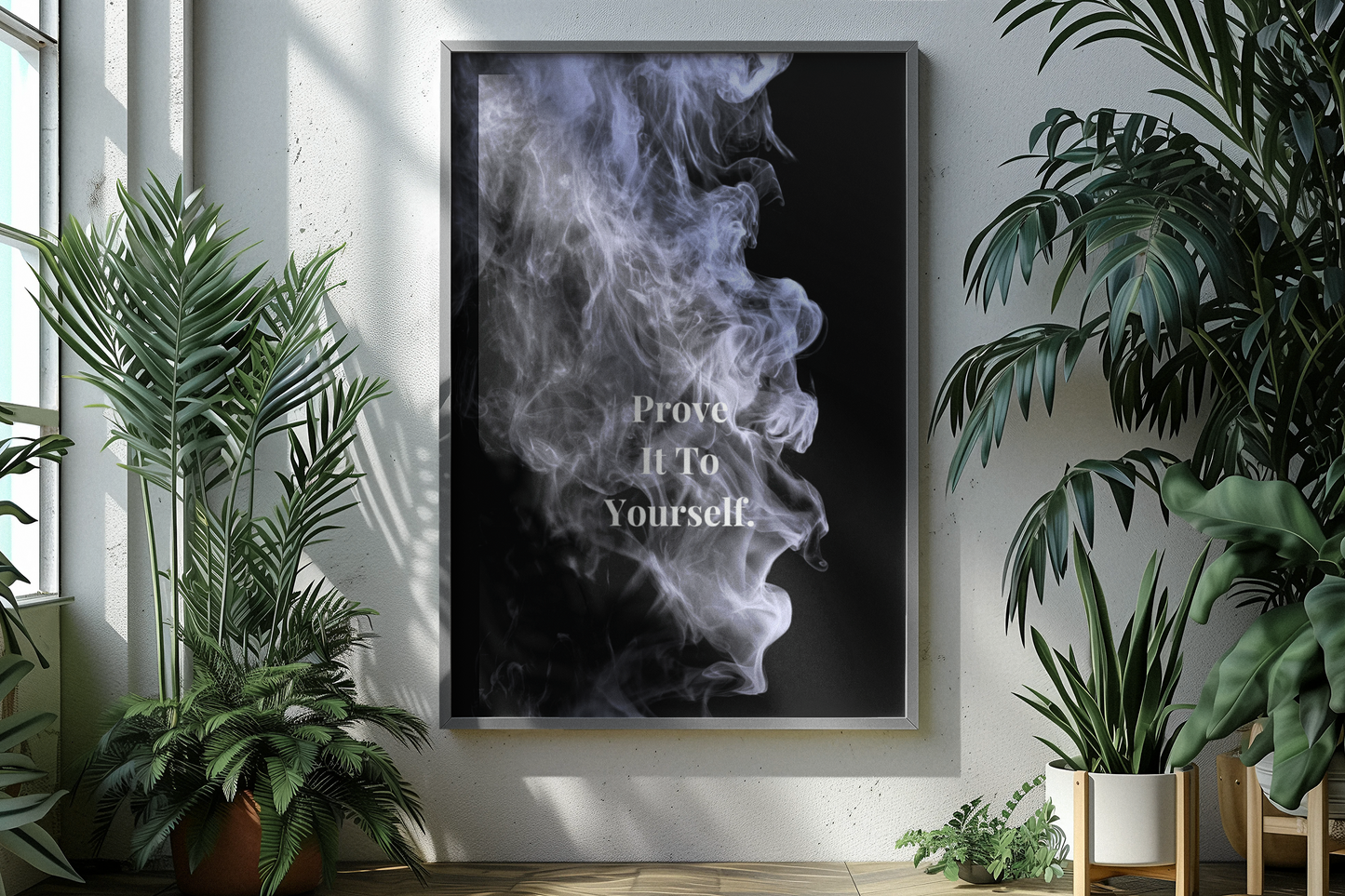A framed vertical wall art print hangs on a light wall in a styled interior. The print shows a black background with white smoke and the text 'Prove It To Yourself'.