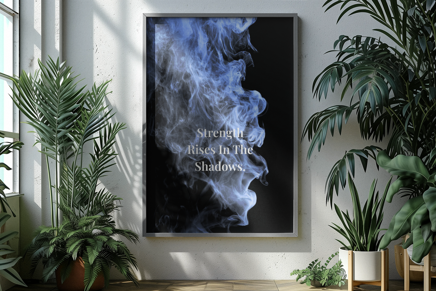 A framed vertical wall art print hangs on a light wall in a styled interior. The print shows a black background with blue smoke and the typography.