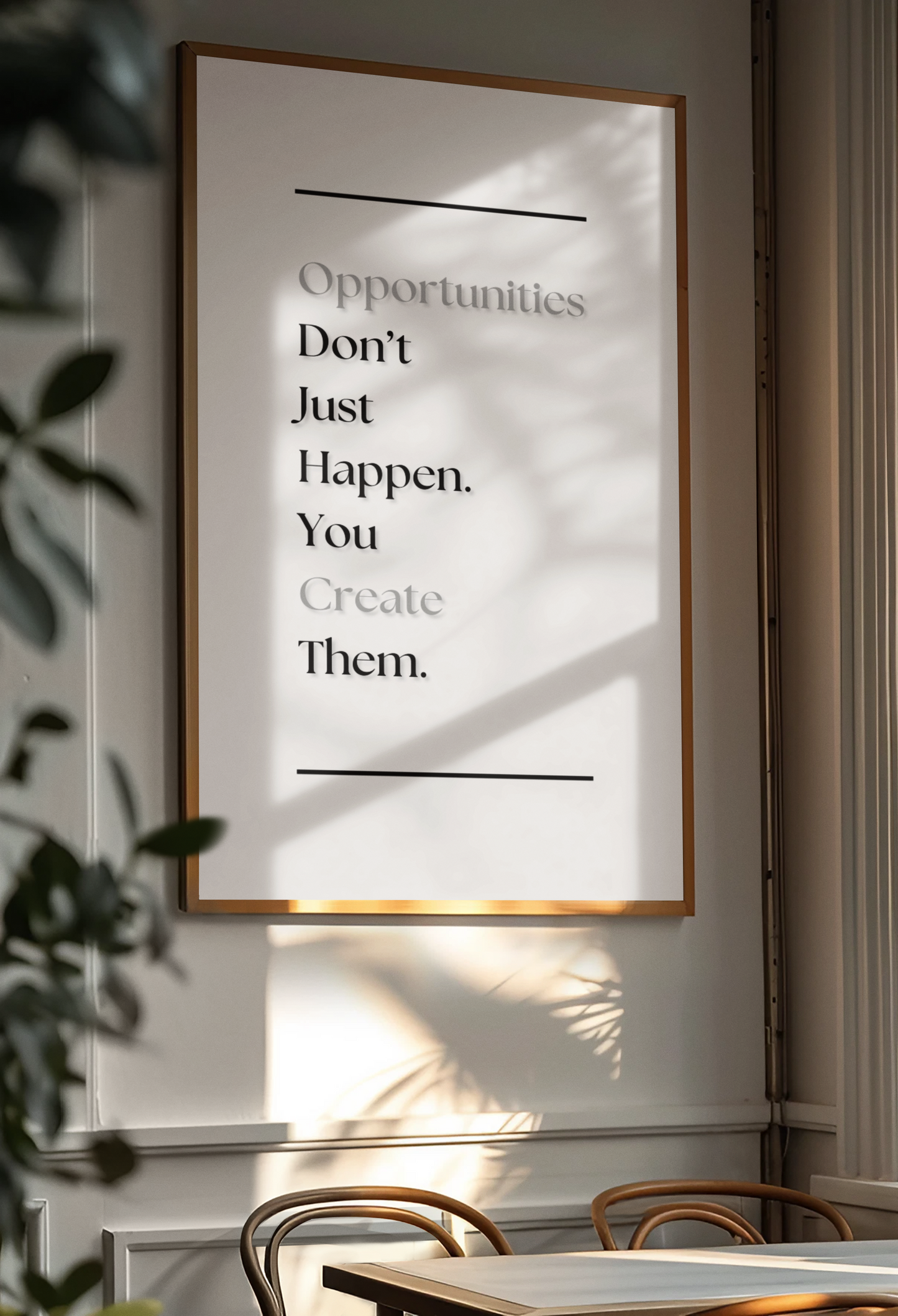 A framed motivational wall art print hanging on a light gray wall in a dining room. The print features the text 'Opportunities Don't Just Happen. You Create Them'.