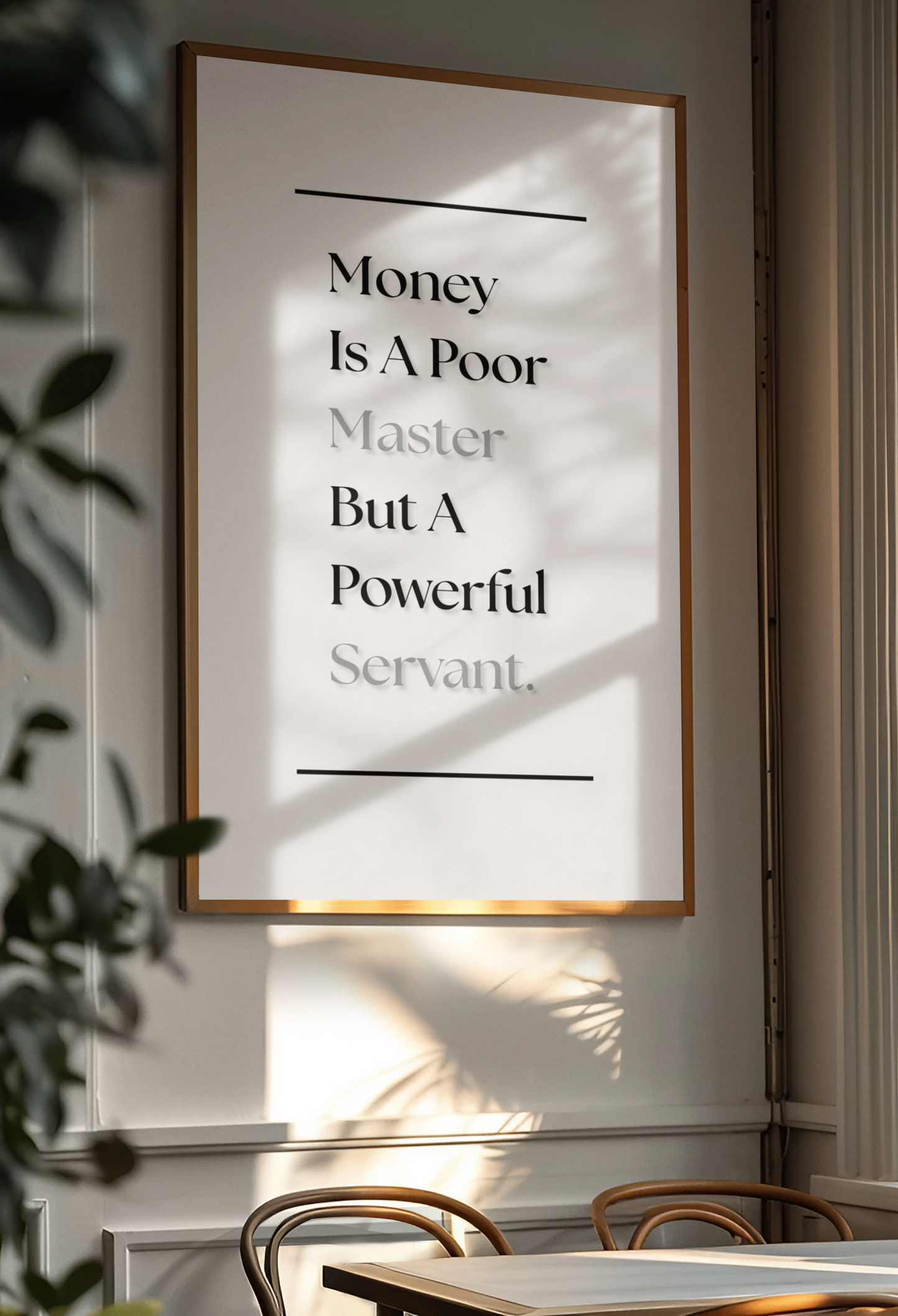 A framed typographic wall art print hanging on a light wall in a dining or living space. The print contains the quote, 'Money Is A Poor Master But A Powerful Servant,' in black and gray text on a white background.