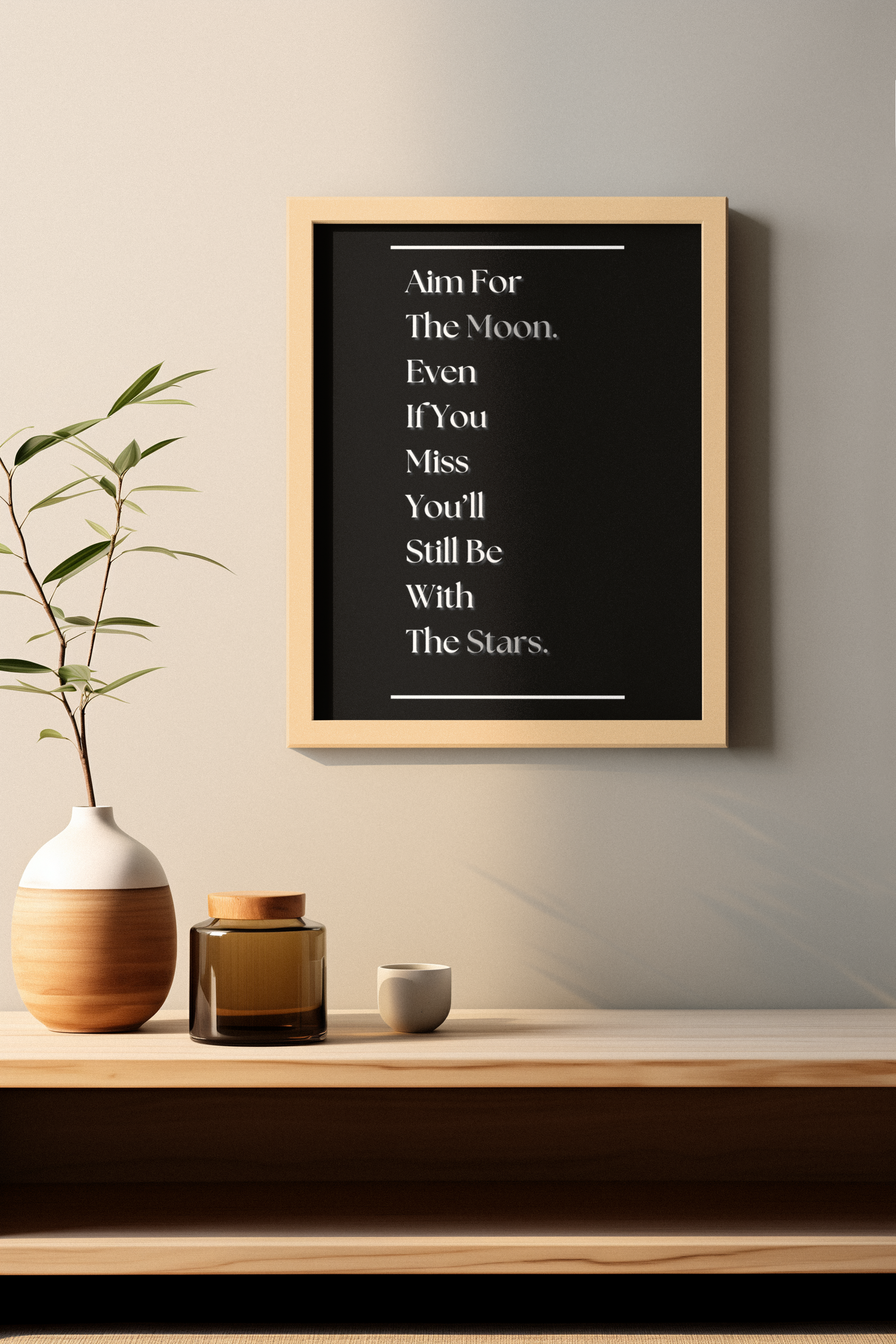 A framed black chalkboard-style wall art print with white text reading 'Aim For The Moon. Even If You Miss You'll Still Be With The Stars.