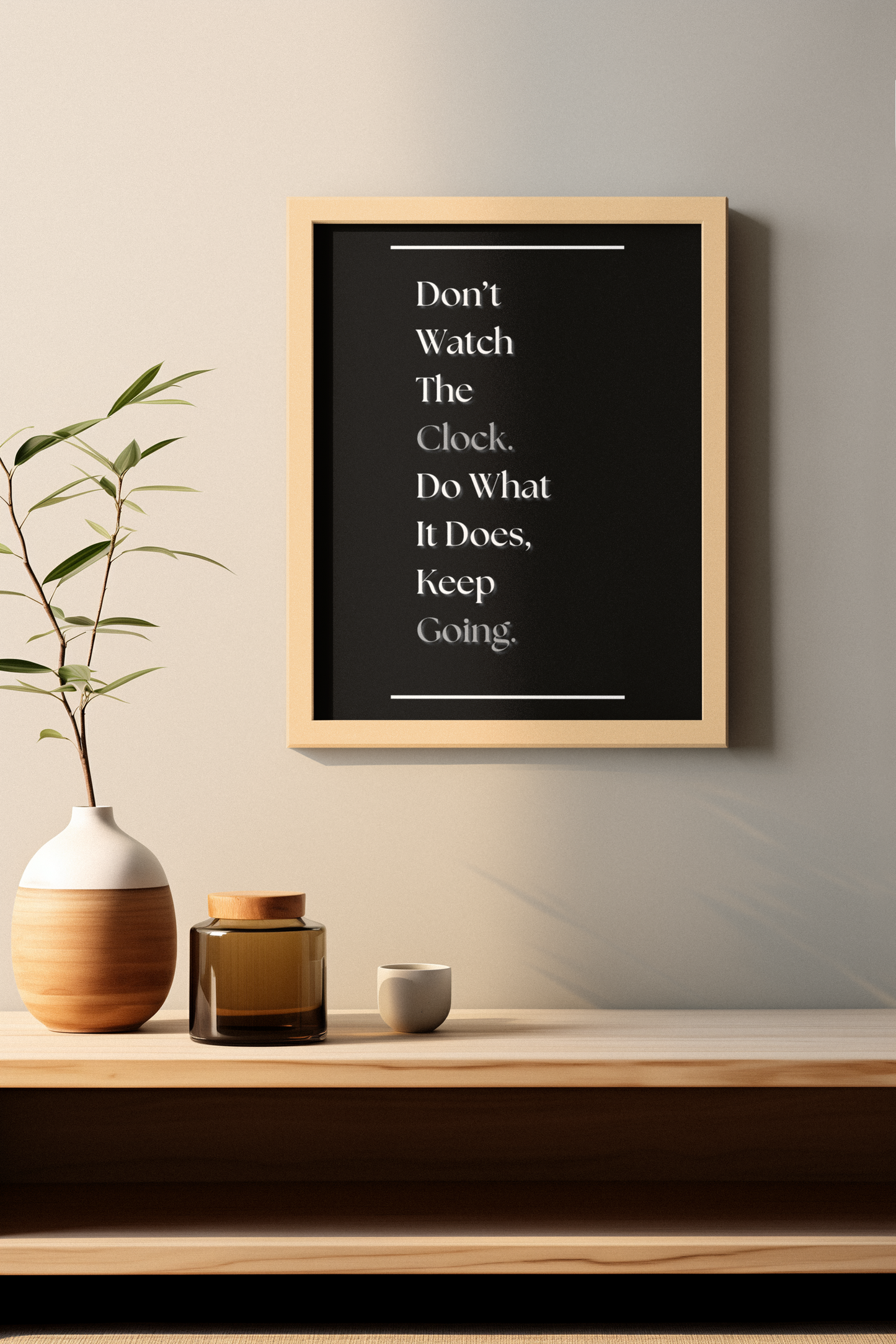 A framed motivational wall art print with the quote 'Don't Watch The Clock. Do What It Does, Keep Going.'