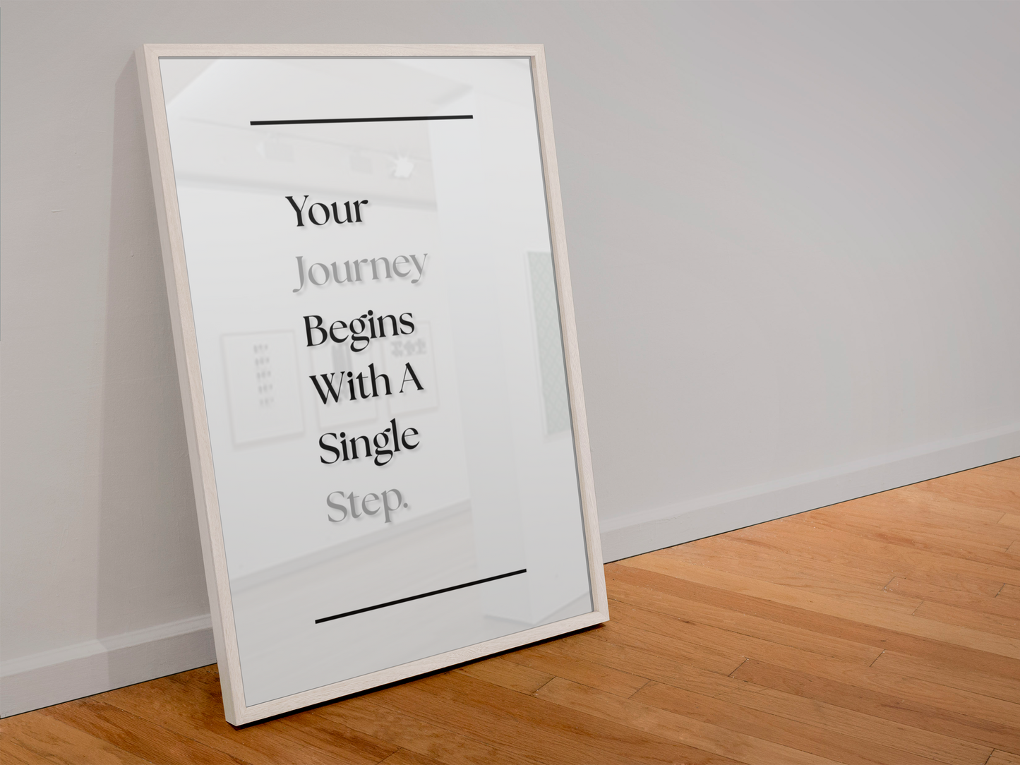 A framed motivational wall art print leaning against a white wall on a light wood floor. The print features the text 'Your Journey Begins With A Single Step.