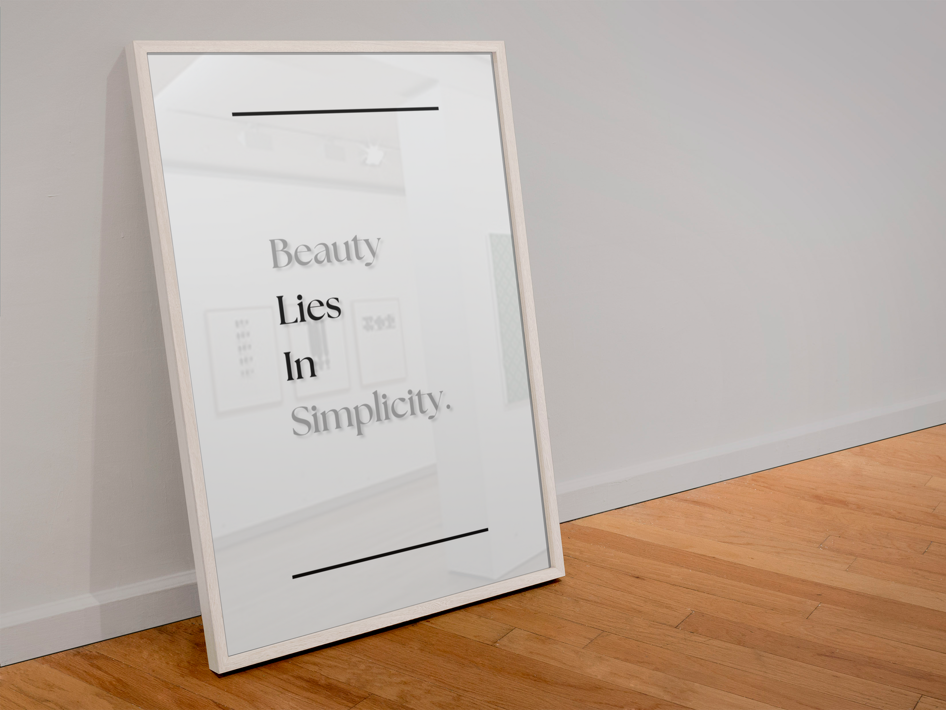 A framed minimalist art print leaning against a white wall on a light wood floor. The print features the text 'Beauty Lies In Simplicity.