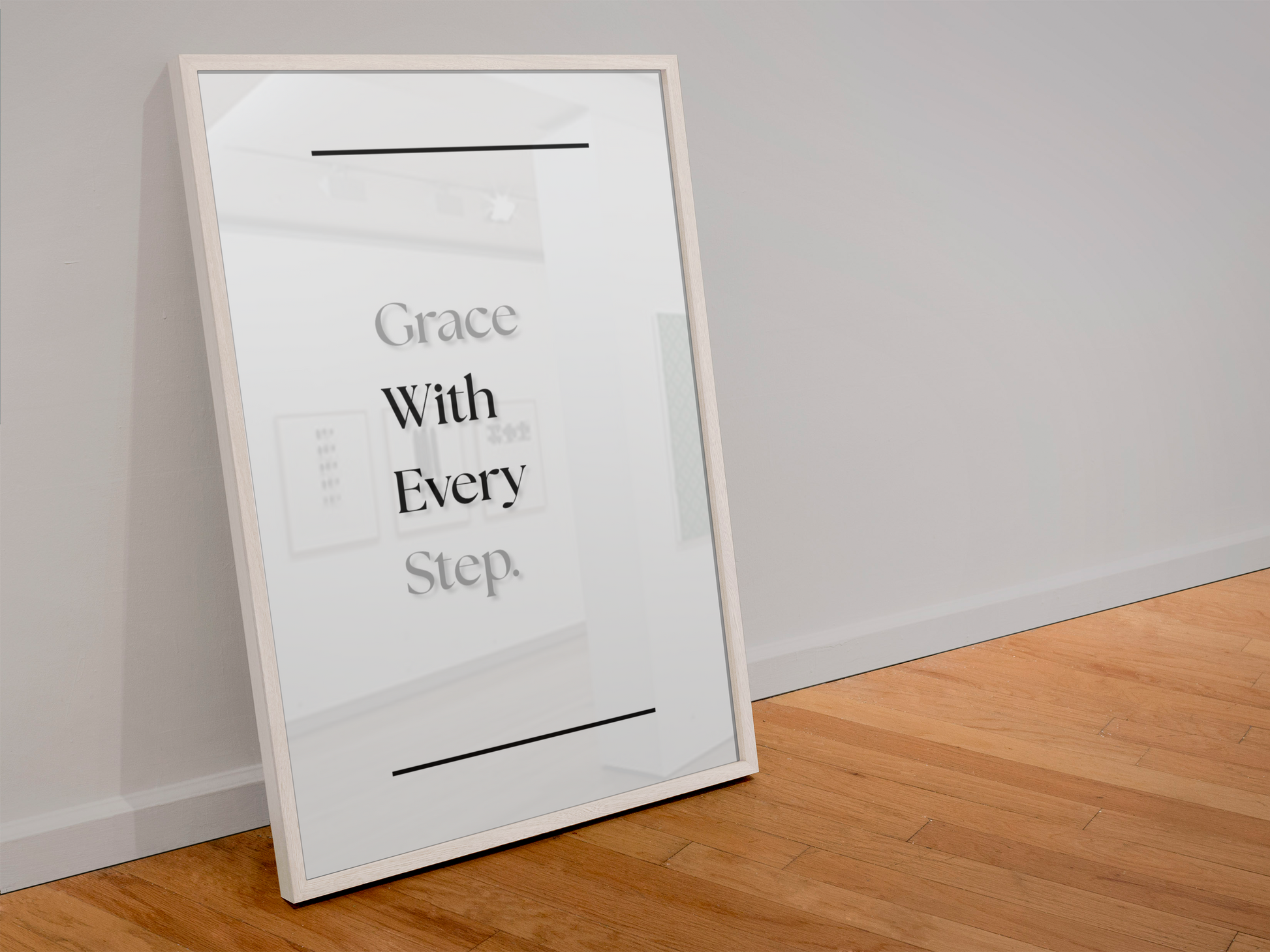 A framed minimalist art print leaning against a light gray wall on a wooden floor. The print features the quote 'Grace With Every Step'.