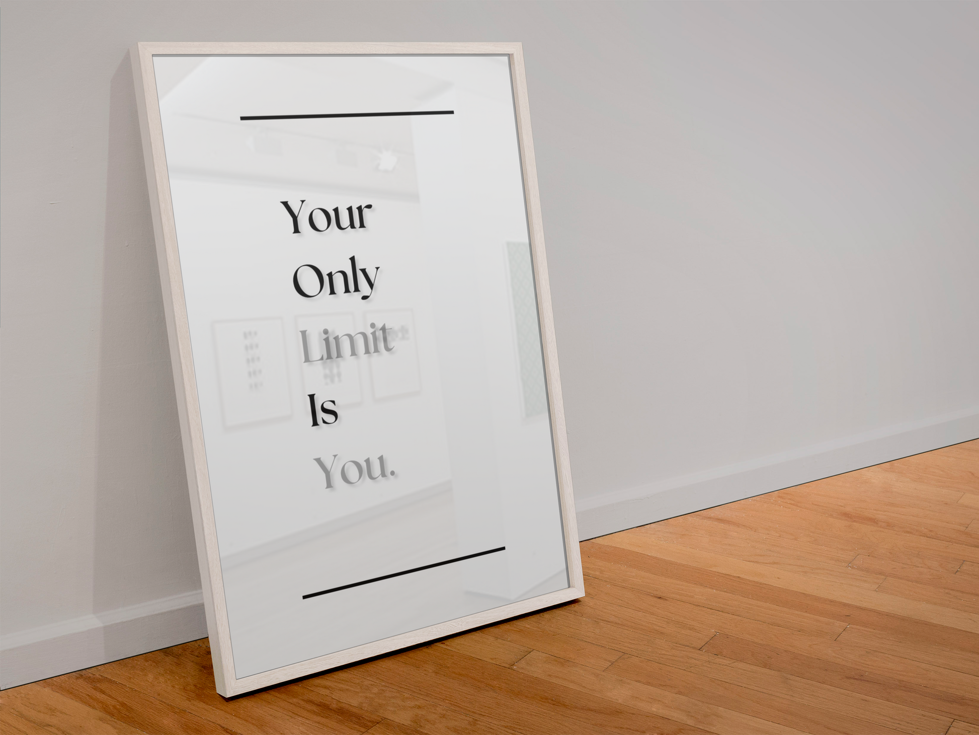 A framed motivational art print leaning against a white wall on a light wood floor. The print features the text 'Your Only Limit Is You'.