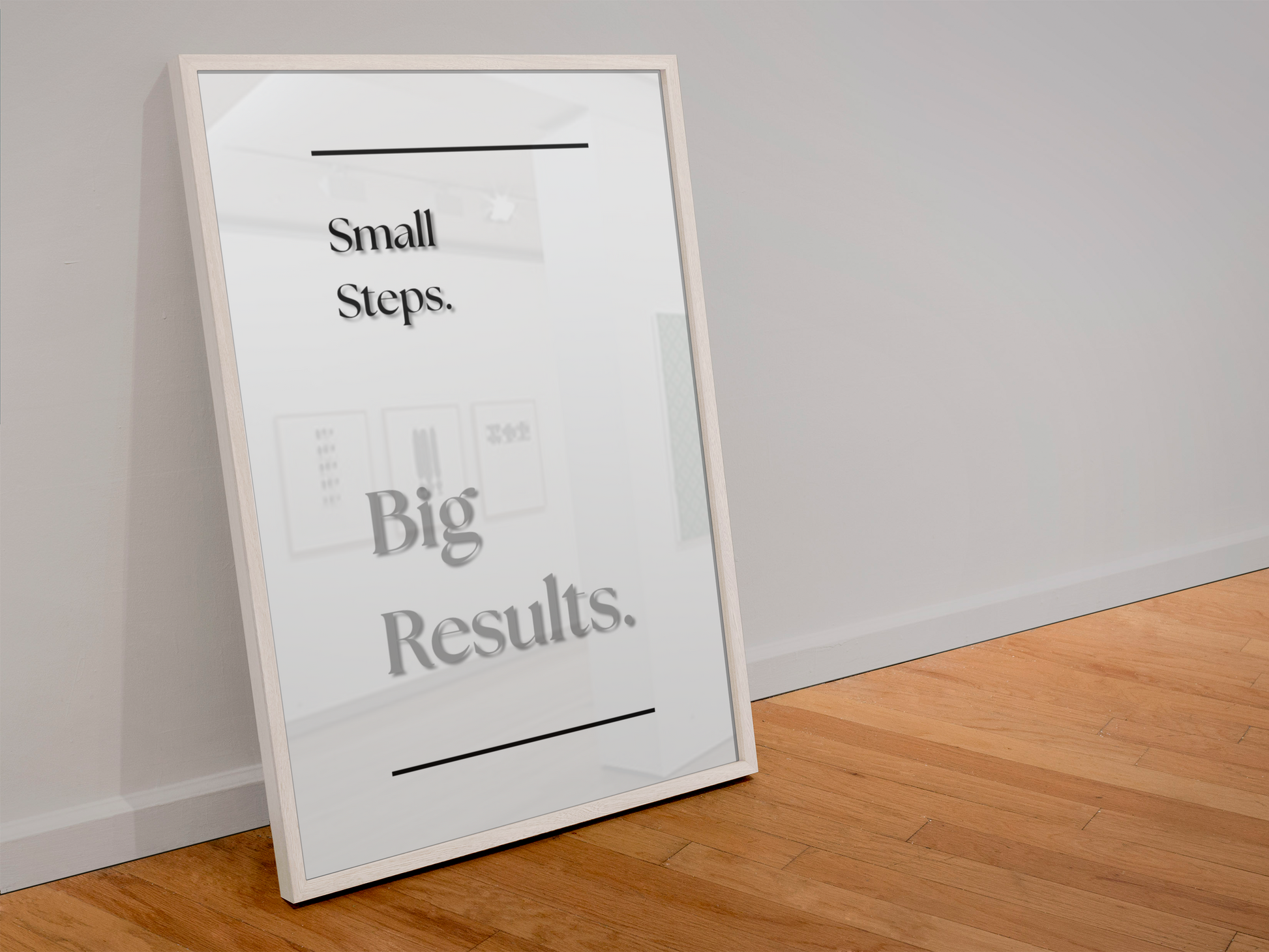 A framed motivational poster leaning against a white wall on a light wood floor. The poster has a white background with black and gray text reading 'Small Steps. Big Results.'
